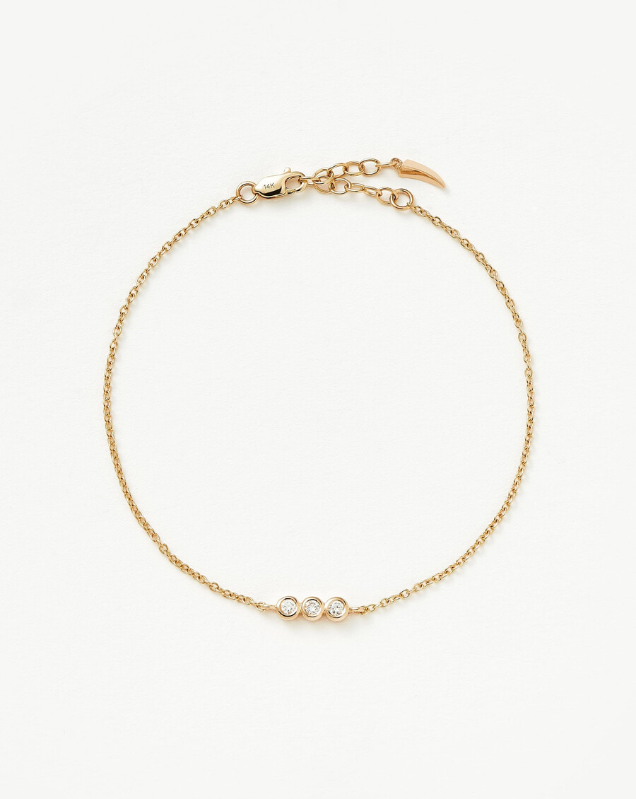 pulsera de tres solitarios de diamantes finos - oro