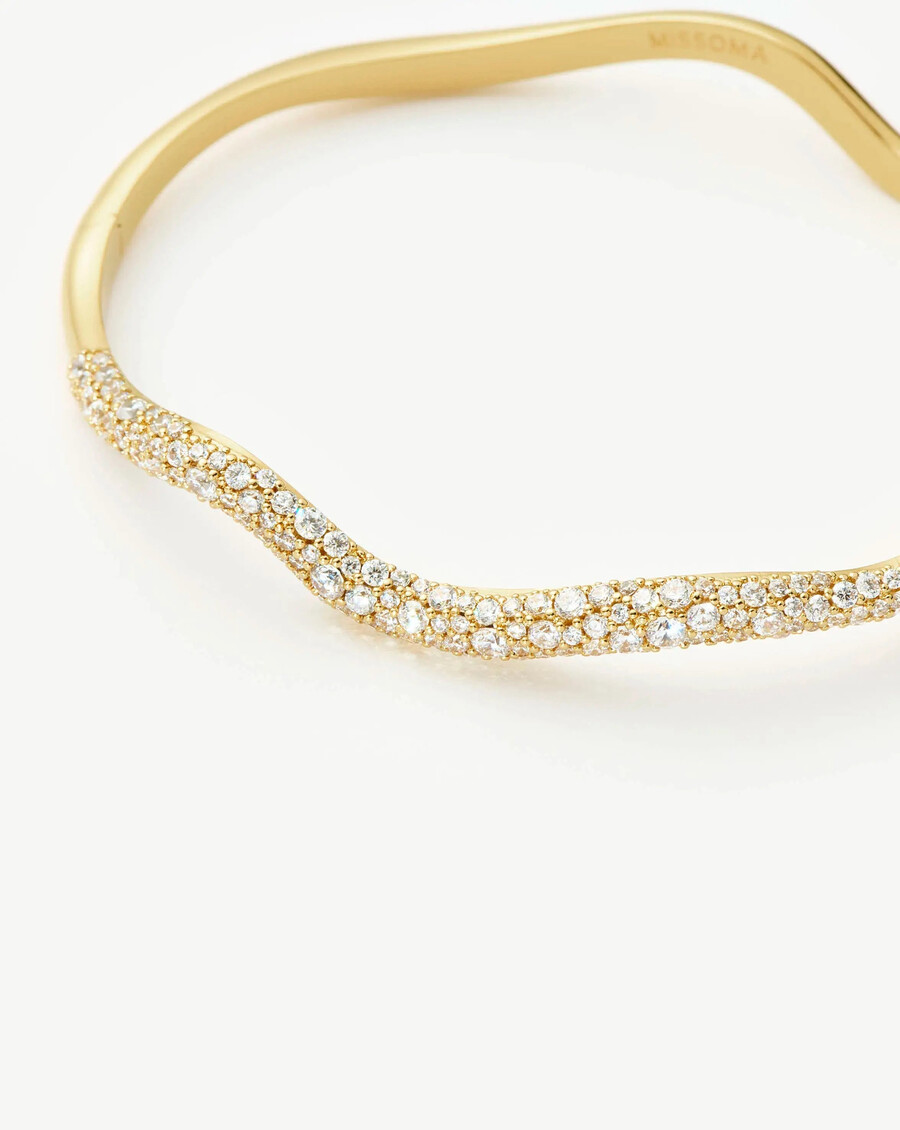 brazalete con bisagras de ondas de nieve fundida - oro