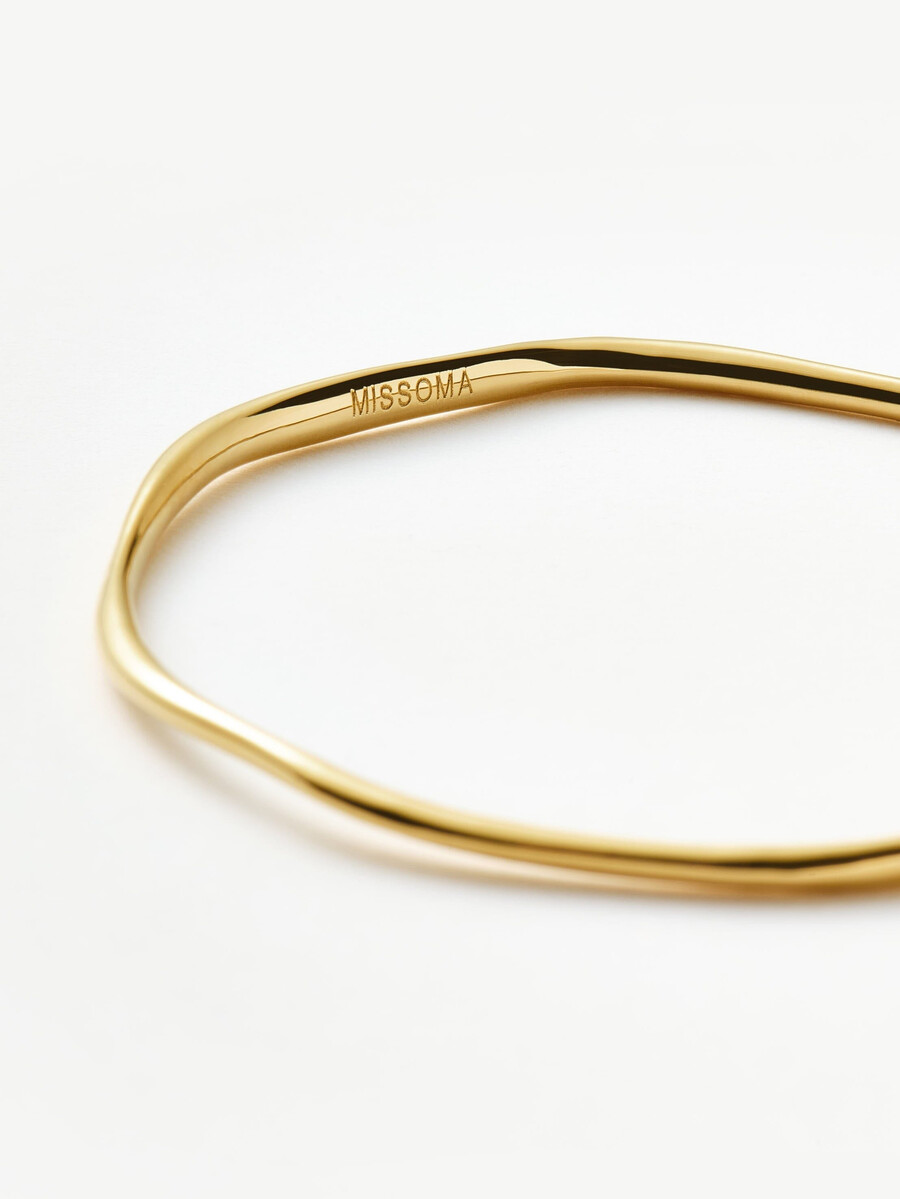 brazalete de ondas fundidas - oro