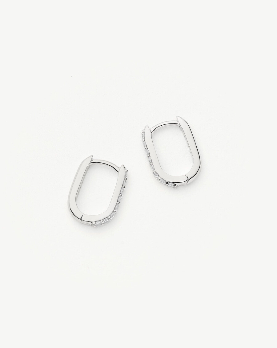 aros mini ovalados con diamantes en oro blanco macizo de 14 k