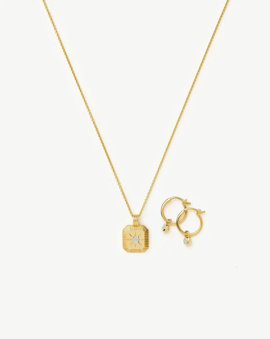 conjunto de collar y pendientes con dijes de piedra natal de marzo - oro