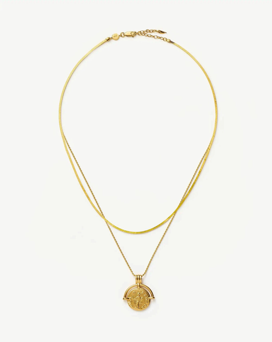 conjunto de collar dorado con arco romano y serpiente de lucy williams