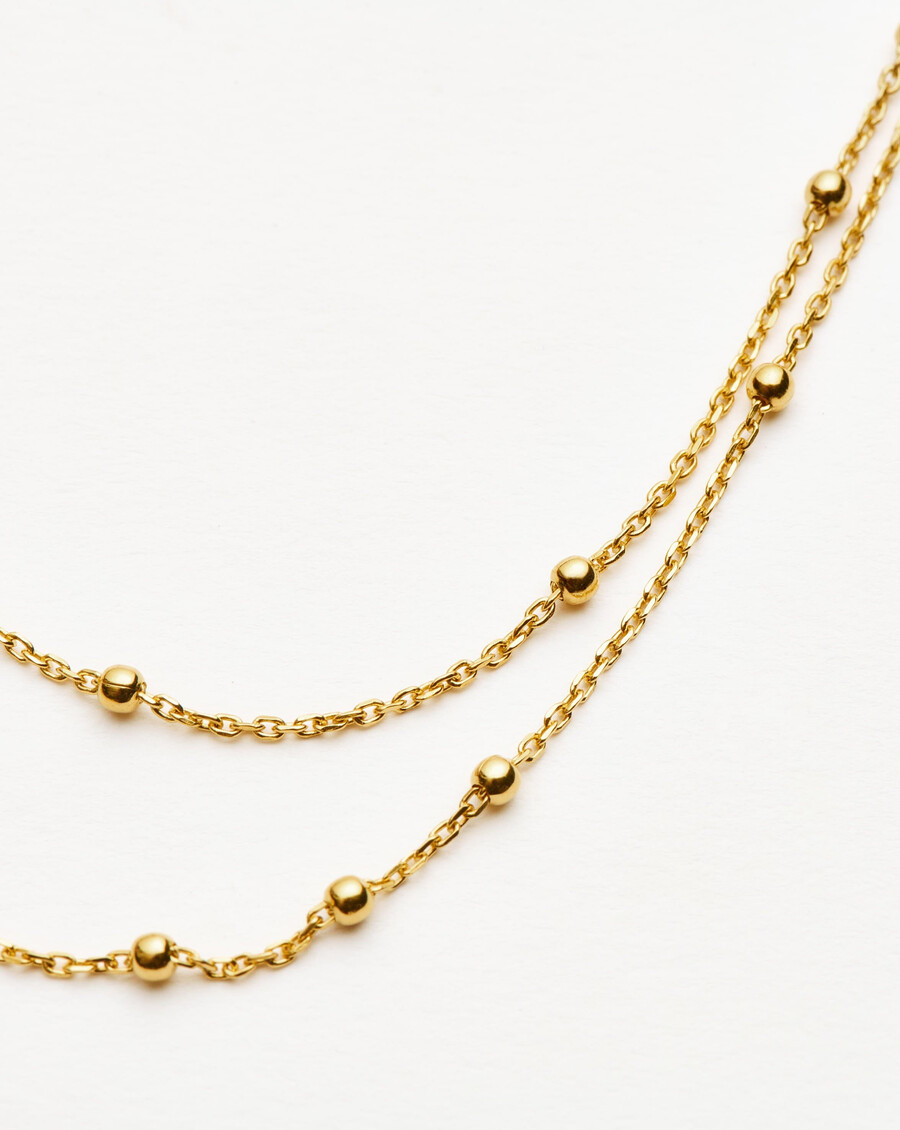 collar de oro con doble cadena