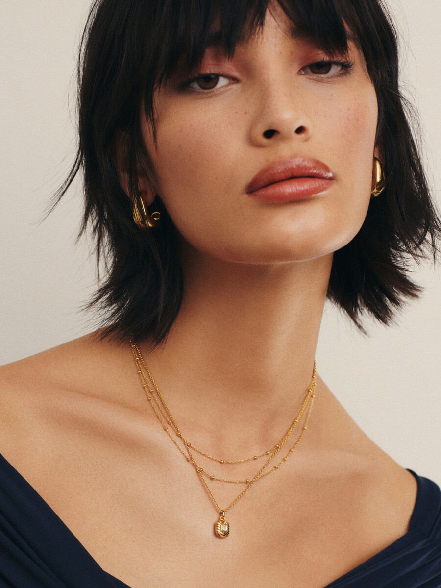 collar de oro con doble cadena
