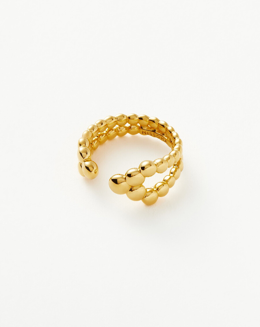 anillo abierto con cuentas